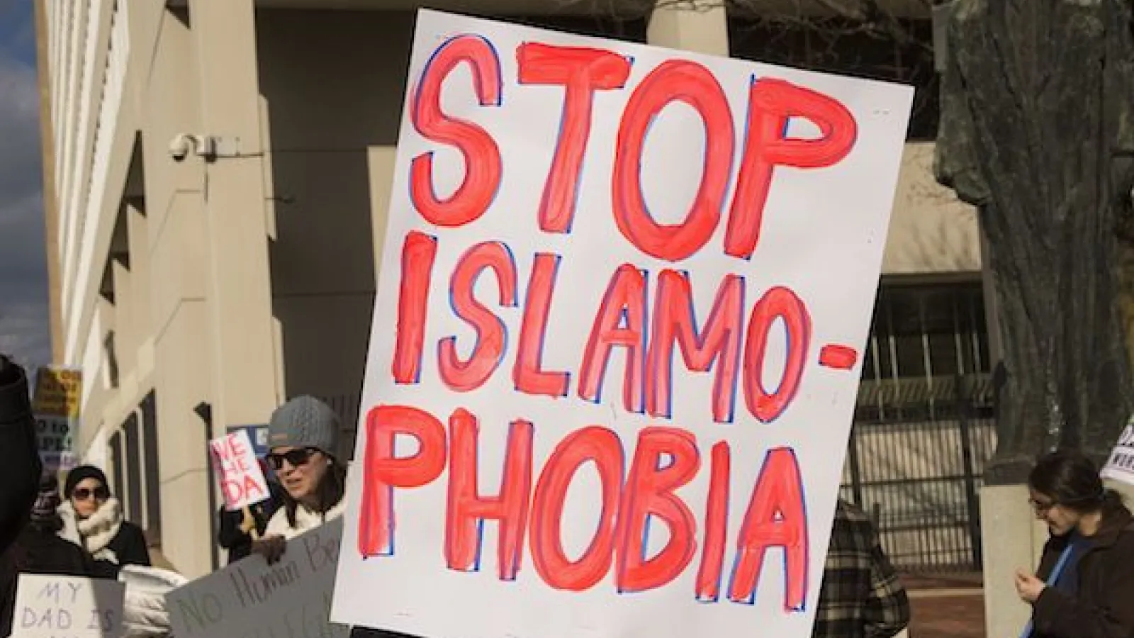 White poster that says "Stop Islamophobia"