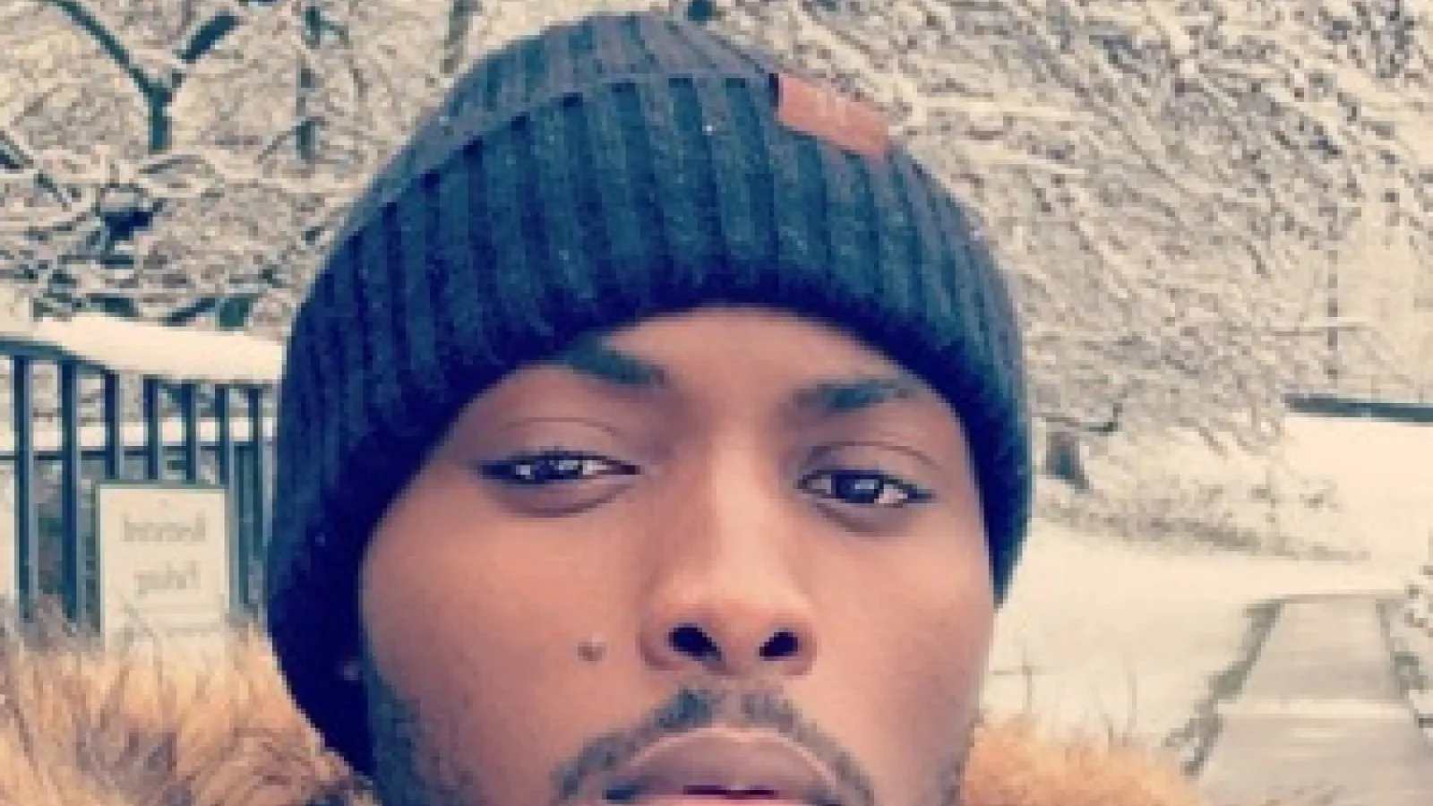 Headshot of Ishmael Konney, an African American man wearing a winter coat and a black winter hat