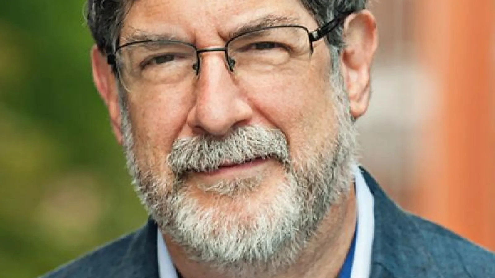 A person with a grey beard and glasses, Michael Swartz