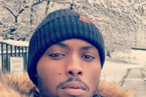 Headshot of Ishmael Konney, an African American man wearing a winter coat and a black winter hat