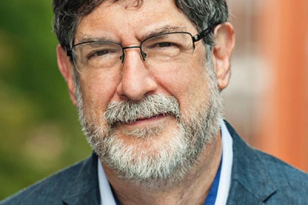 A person with a grey beard and glasses, Michael Swartz